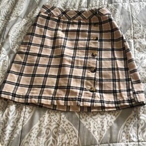 tan, black and white mini skirt
